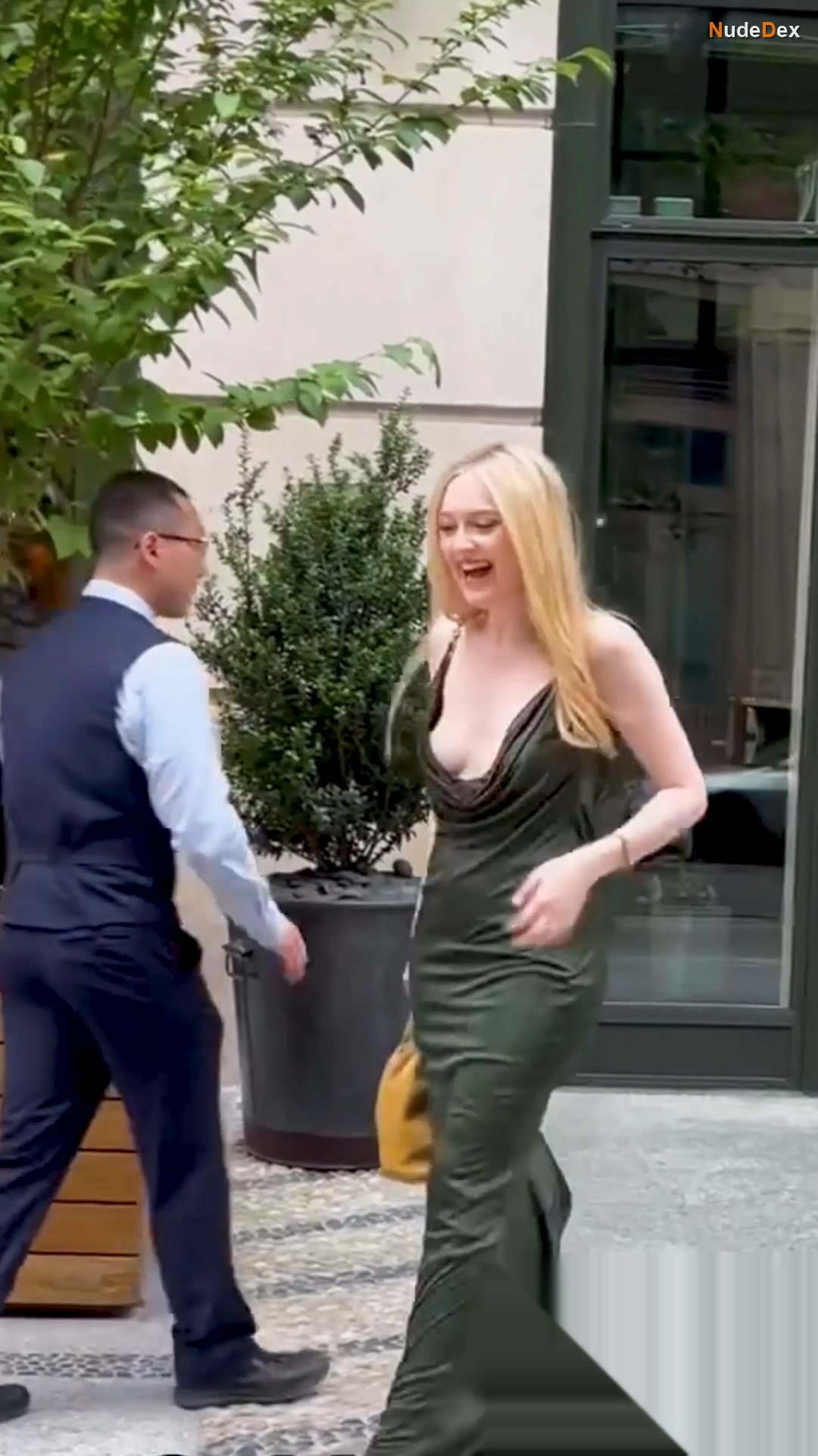 Deep Cleavage In A Sleek Green Dress